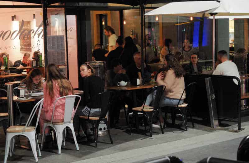 Patrons dining at Asian restaurants on Little Malop Street.