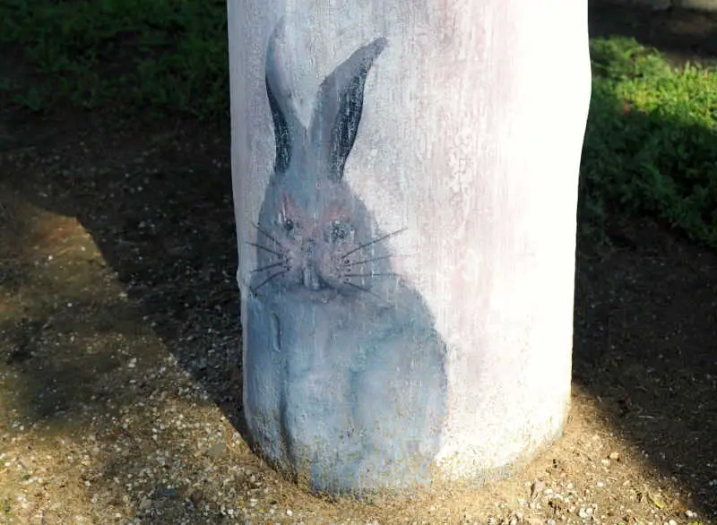 A painted rabbit at the bottom of a Geelong bollard.