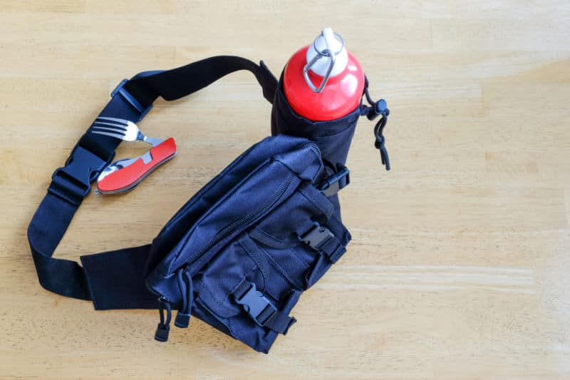 Image of one of the best bum bags Australia has with a drink bottle holder, swiss army knife, zips and pockets.