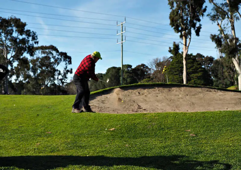 Bunker and golfer at one of the many golf clubs Geelong has.