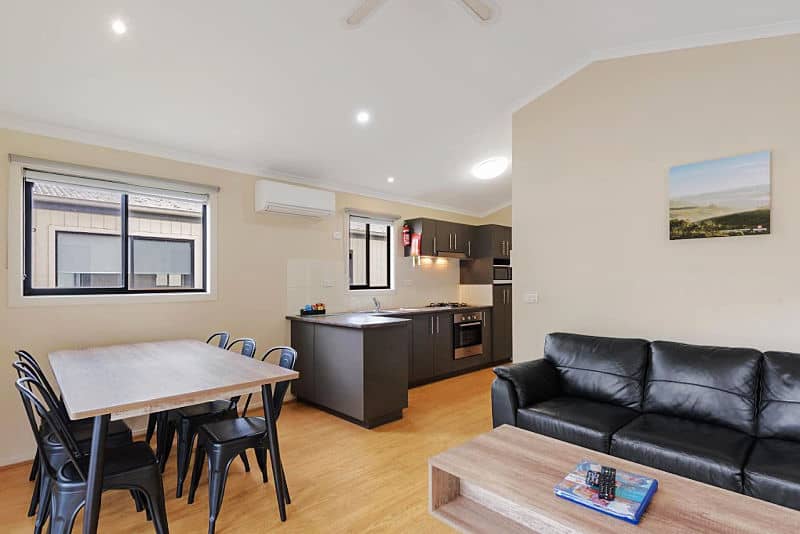 Kitchen, lounge, dining area of a Geelong caravan park cabin.