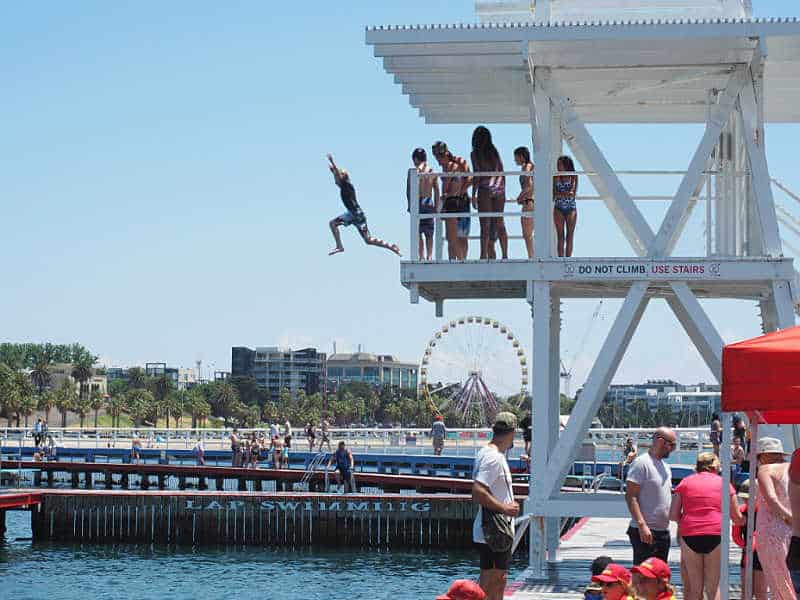 Boy jumping off the Eastern Beach dive tower.