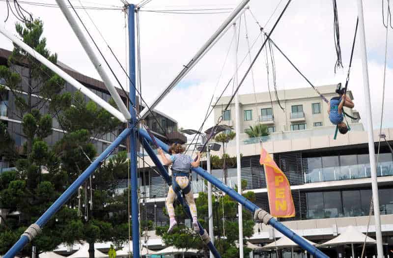 Kids doing somersaults on the Geelong Bungy Trampoline.
