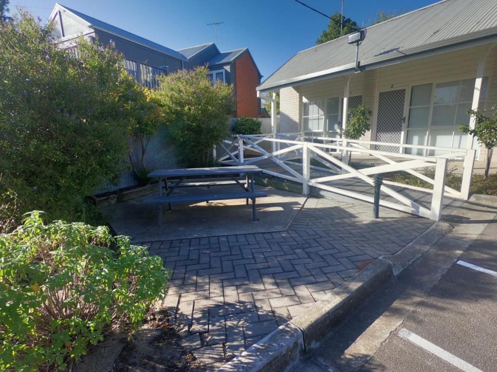 Entrance with ramp and outdoor table at Geelong CBD Accommodation.