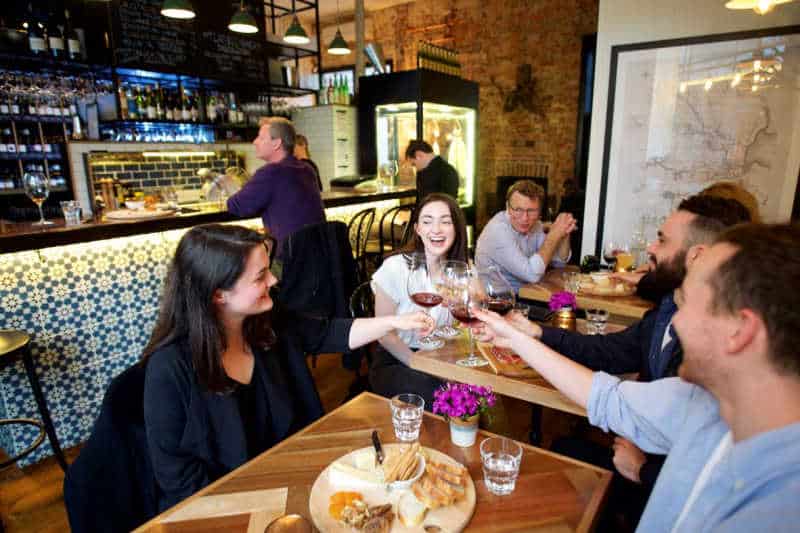 Patrons drinking a toast at Geelong cellar door.