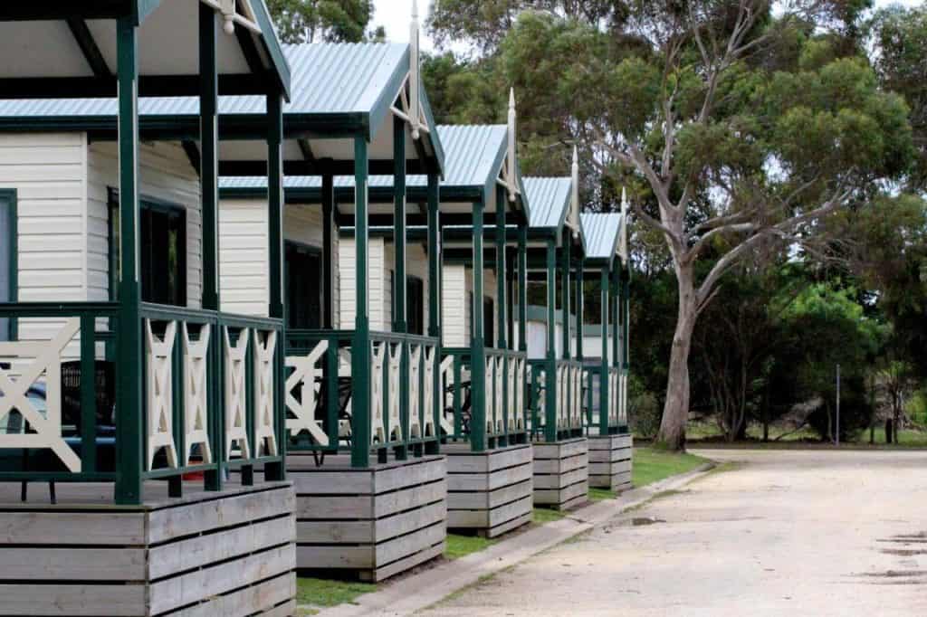 Cabins lined up in a row at a Geelong holiday park.