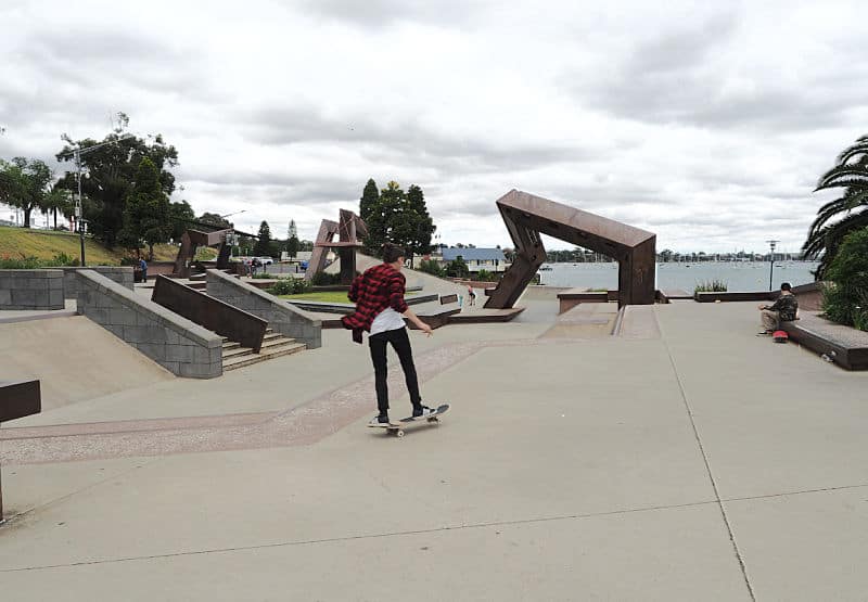 Teenager riding a skateboard at the Geelong Waterfront Skate Park. A great kids activity in Geelong.