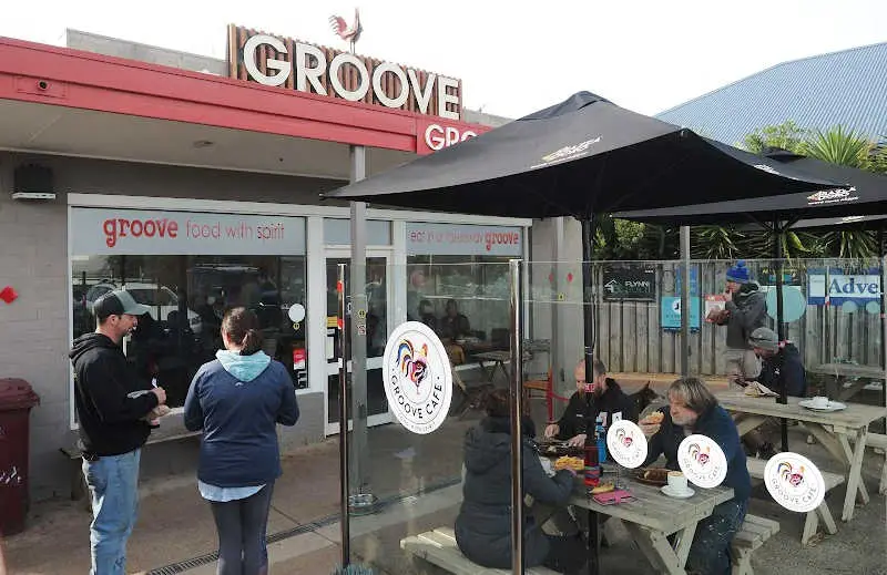 People chatting outside the Groove Cafe one of the popular cafes in Ocean Grove.