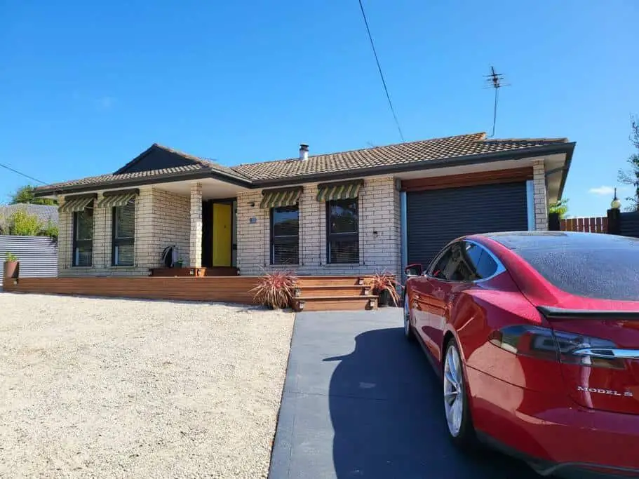 Front entrance with driveway and car at Homely Belmont Getaway pet friendly accommodation in Geelong.