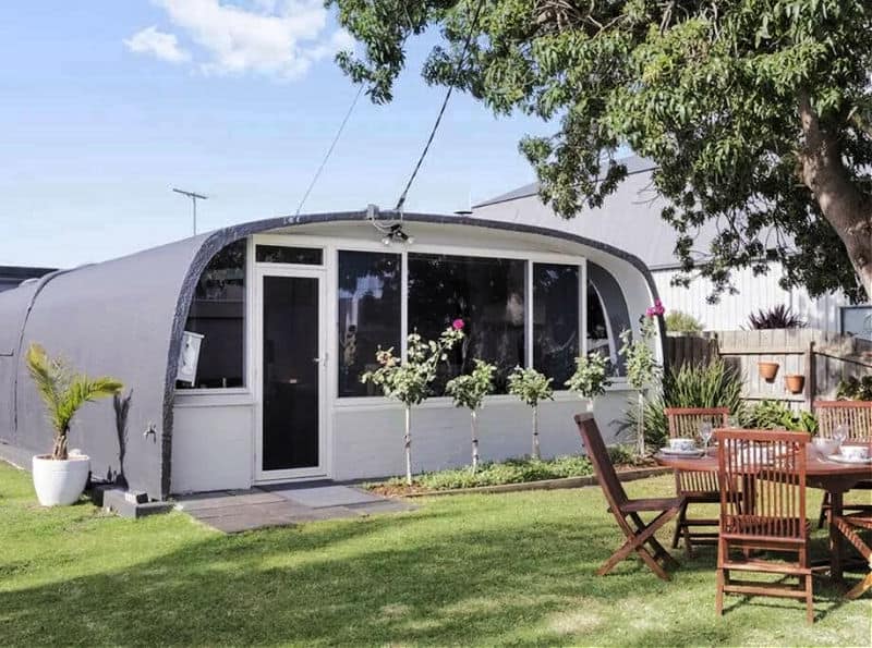 Exterior view of Igloo Cottage accommodation in Portarlington with a garden and outdoor setting.