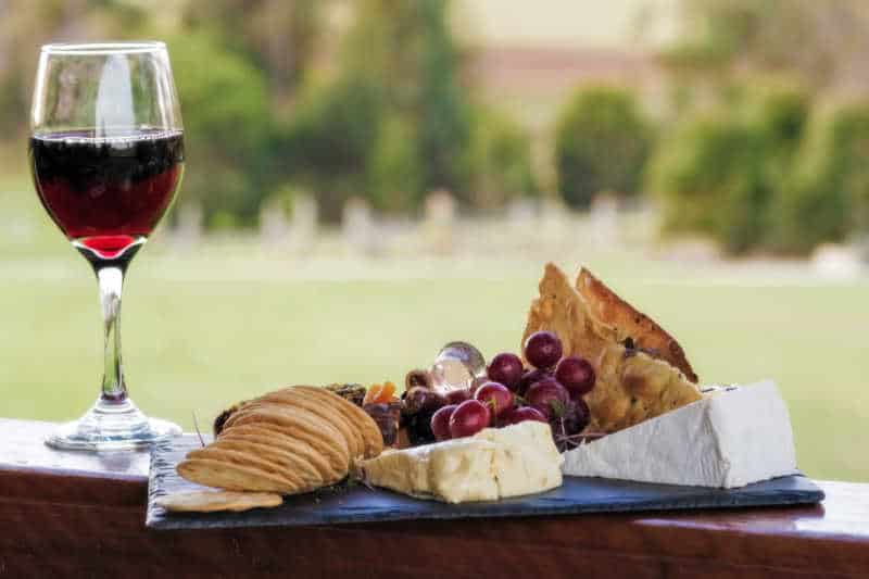 Image of red wine glass and cheese plate Lorne Great Ocean Road winery.