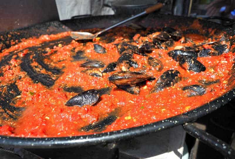 Mussels cooking in a tomato sauce at Portarlington Mussel Festival.