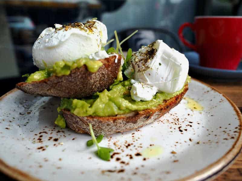 Smashed avocado and poached eggs breakfast at one of the many Pakington Street Cafes