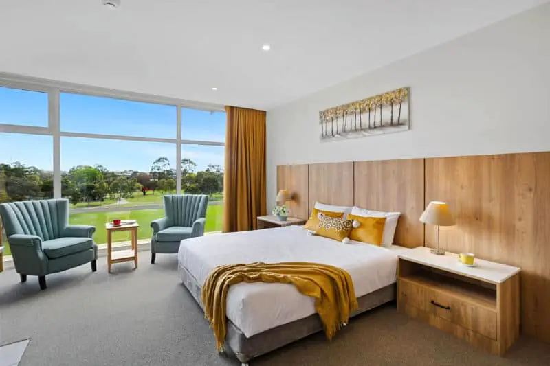 Guest room with large windows overlooking the park at Parkside Motel Geelong 