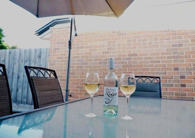 Alfresco area with wine and glasses and Port Relaxation Portarlington Vic accommodation.