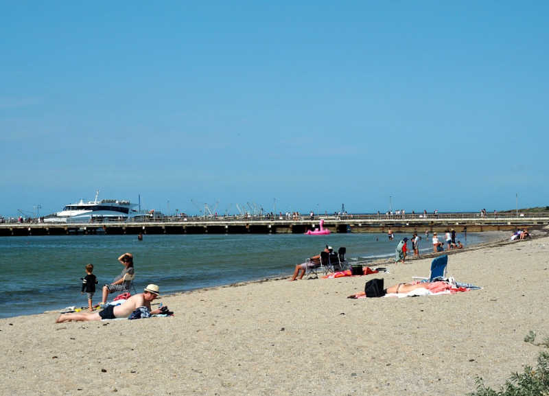 Picture of people at Portarlington Beach and pier.