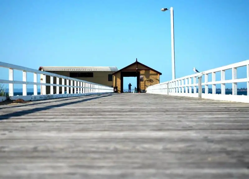Photo of Queenscliff pier and boat shed.