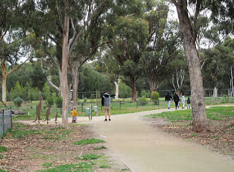 Family with a little enjoying a walk at Serendip Sanctuary one of the great outdoor things to do in Geelong with kids.