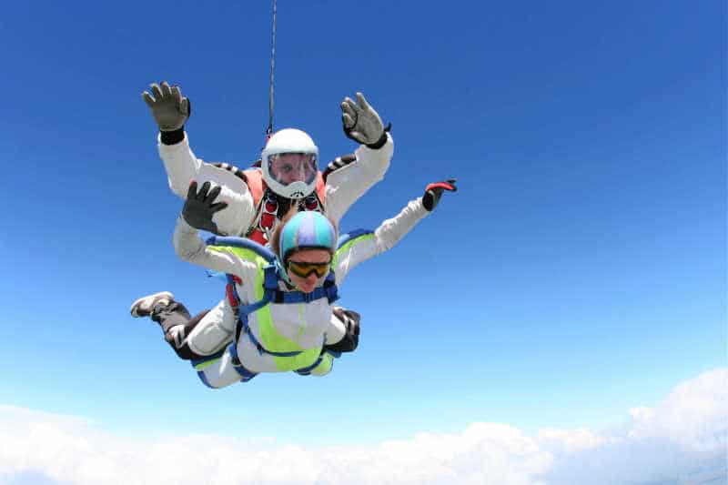 People tandem skydiving on the Great Ocean Road