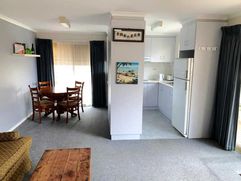 Kitchen, living, and dining area at the Portarlington Holiday Apartment.