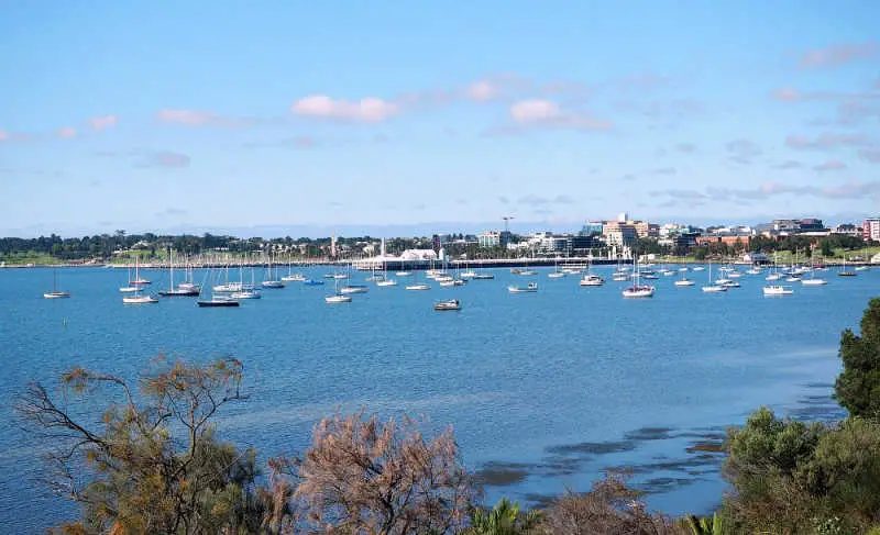 View of Corio Bay with yachts and boats and the city of Geelong in the background.