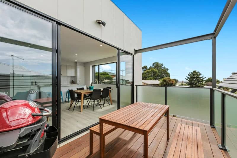 Balcony with outdoor seating at Waterline Property at Portarlington, Victoria.
